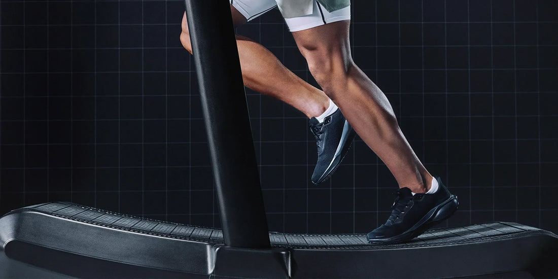 Man running on treadmill wearing athletic shoes 