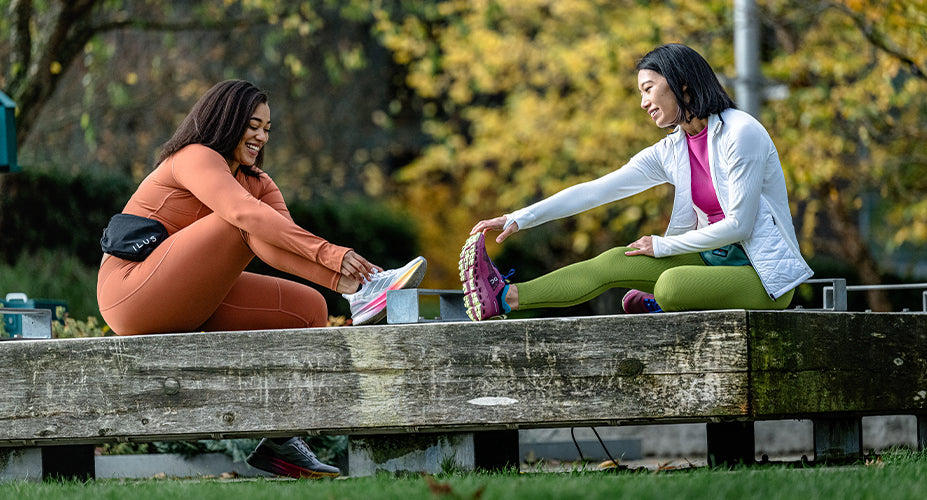 Woman stretching while training with a Couch to 5K program.