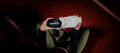 Person holding a white sneaker while putting in Superfeet's ME3D Personalized Insole. 