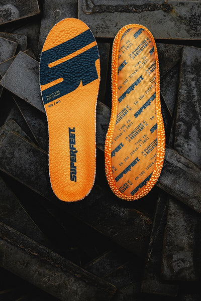 The front and back of Superfeet's Work Puncture Resistant Insole against a dark grey background.