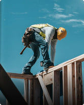 Worker on a construction site with a clear blue sky