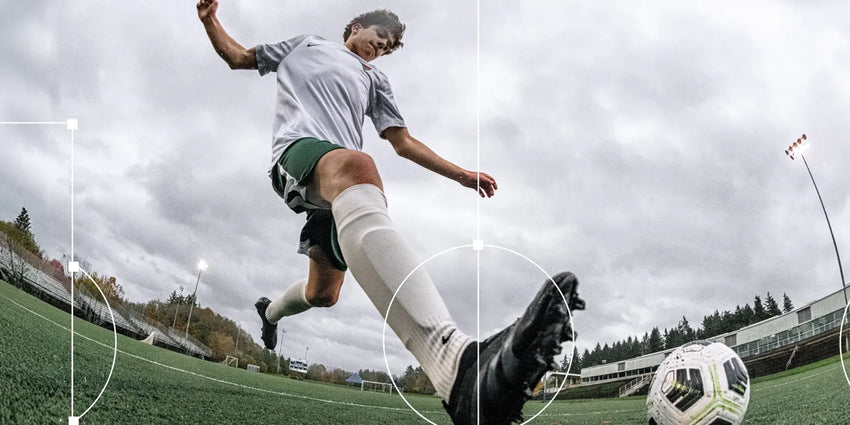 Boy playing soccer and running to kick the ball.