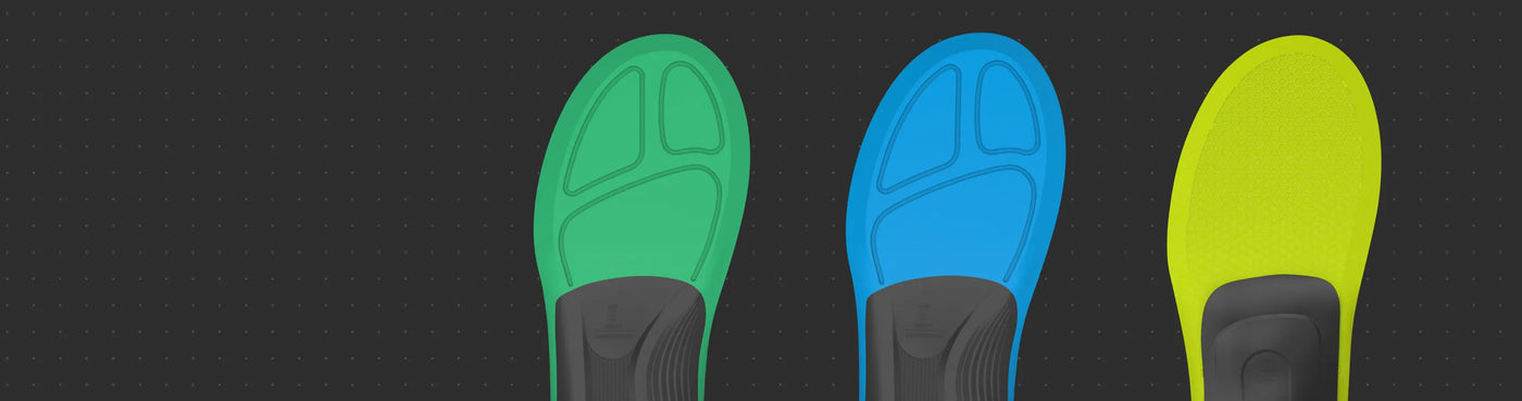 Three colorful shoe insoles on a black background