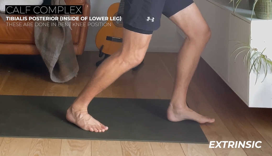 Runner doing stretches with graphic text overlay that says "Calf Complex: Tibialis Posterior (Inside of Lower Leg) These are done in bent knee position."